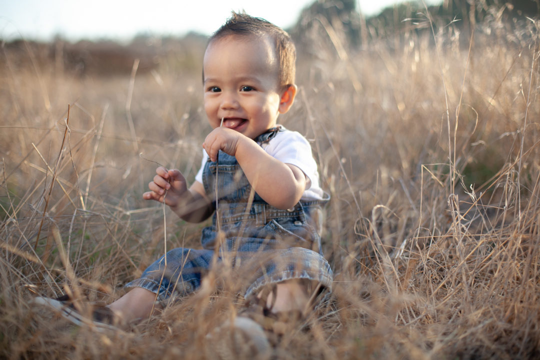 Baby In Field Backlit Before