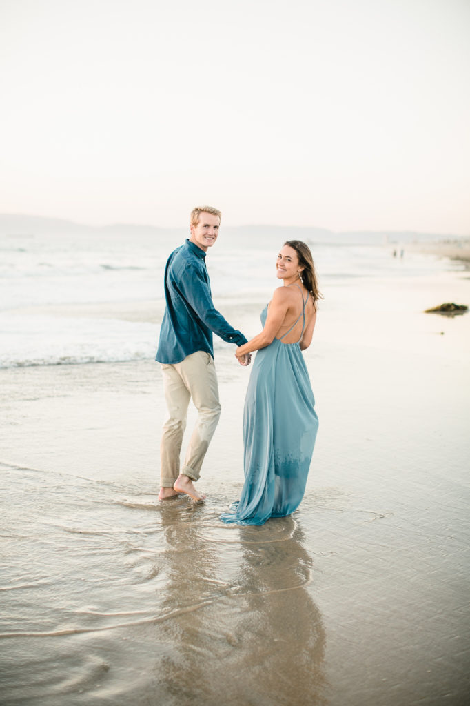 beach engagement photo at golden hour